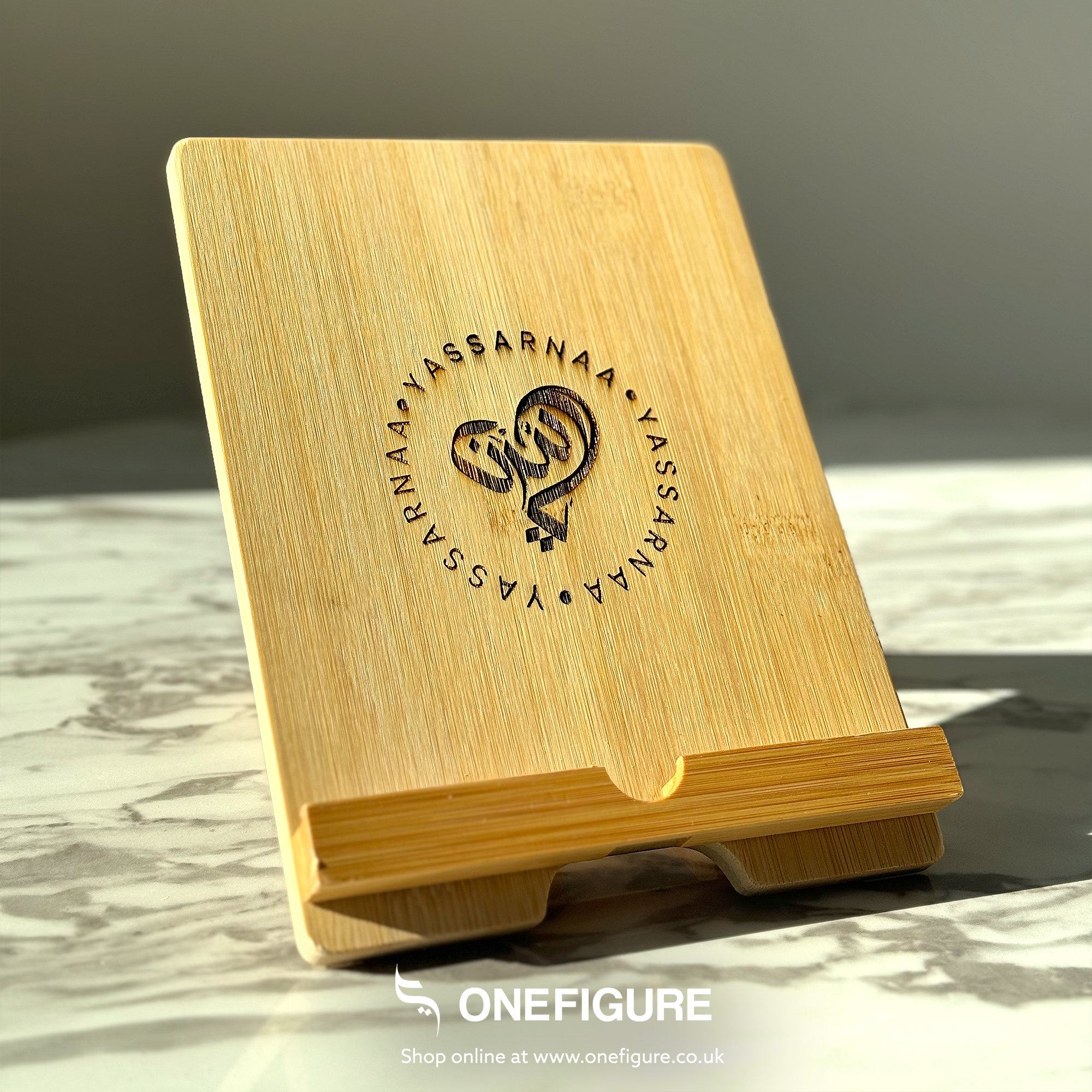 a wooden bookholder with a logo on it